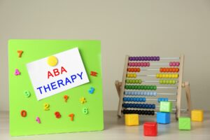 Signage for ABA Therapy pinned to a board