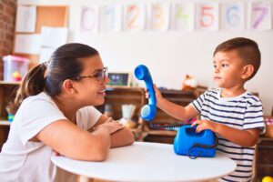 therapist doing occupational therapy with children with autism