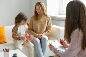 mother and child with autism visiting an autism treatment center for the first time