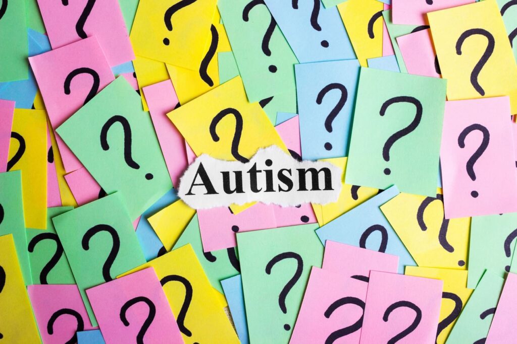 autism sign with lots of question marks
