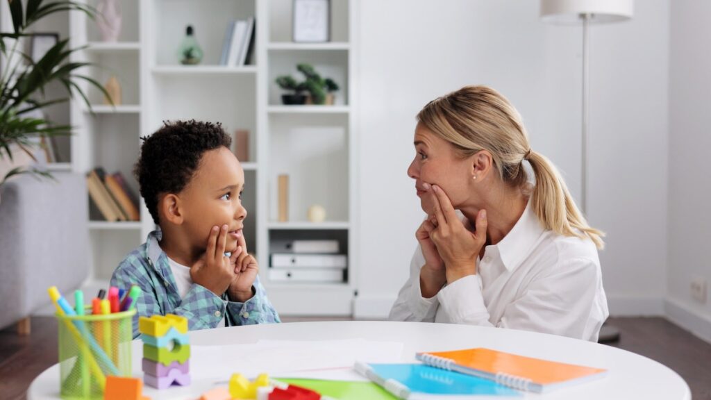 therapist providing individual autism treatment to a child